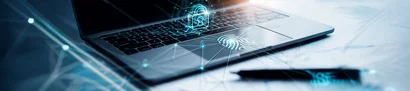 Information Security Consultancy – Protection for Your Data & Processes Symbolic image: a laptop with a padlock and fingerprint icons to represent information security.