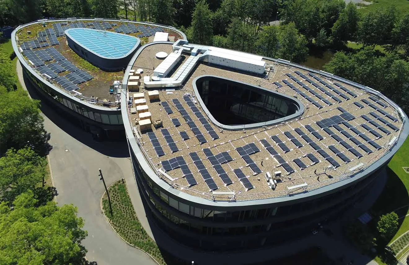 Solar panels on the GOB roof generate clean energy Bird's eye view of photovoltaic system on GOB roof