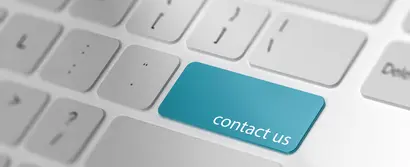 Header image for contact form. White keyboard with turquoise coloured enter key, renamed in "contact us".