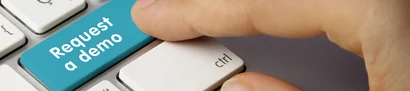Header image: turquoise shift key on grey keyboard, labeled "Request a demo"