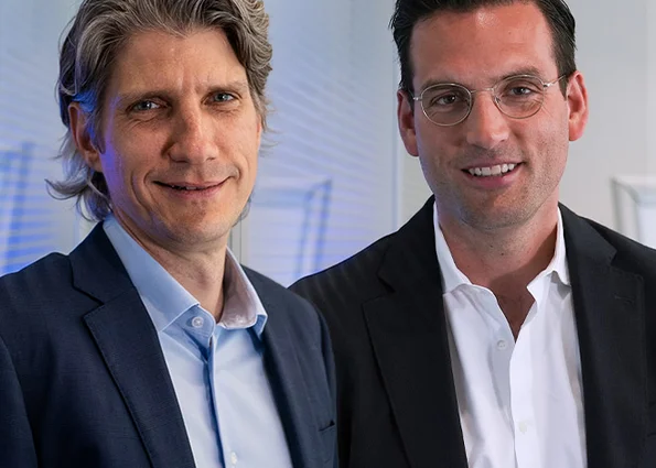 Managing Director Tim Bellen and Robert Küpper smiling into the camera