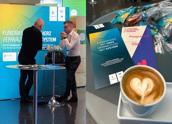 GOB-Mitarbeiter im Gespräch am DFK-Stand, daneben Flyer, Give-aways und Kaffee mit Herzmotiv