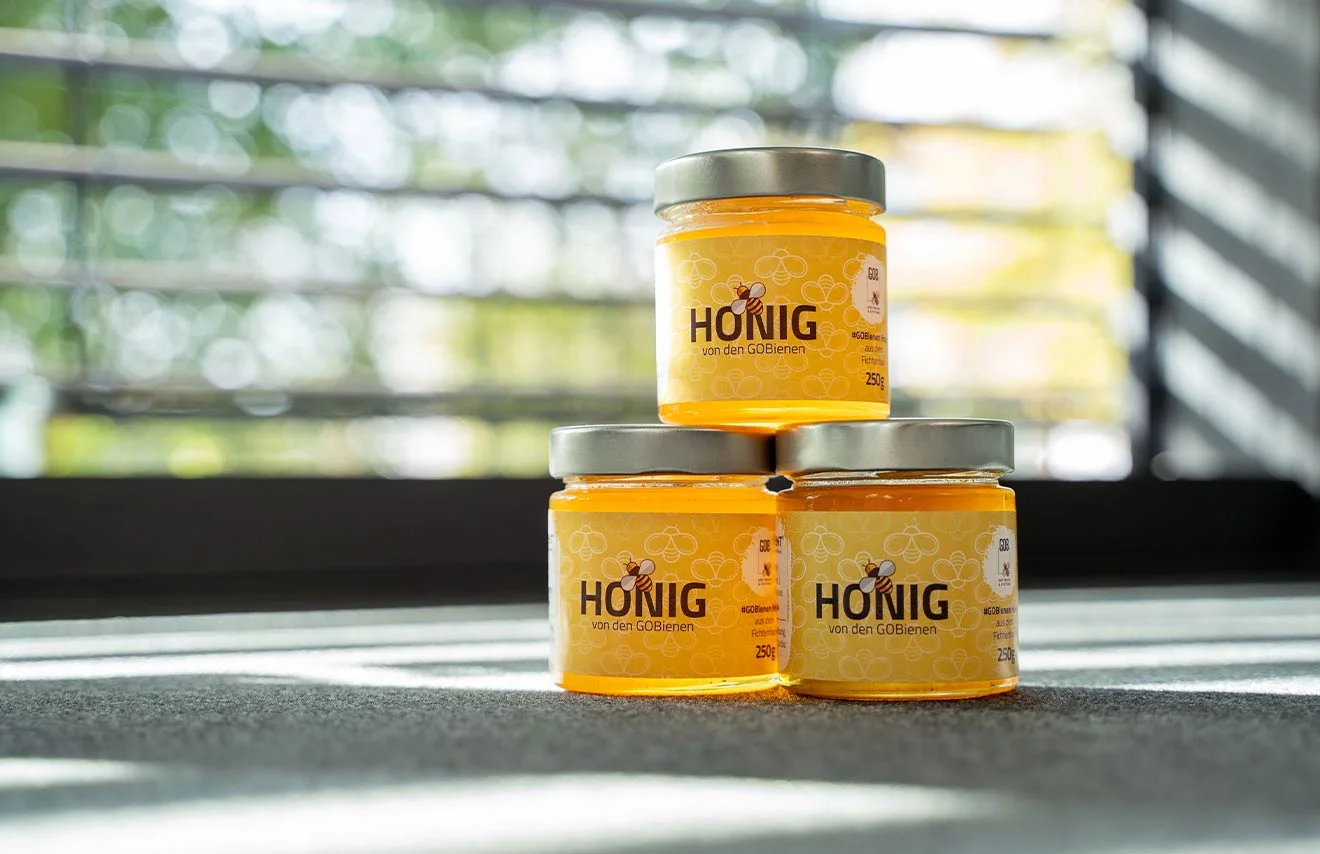 Exclusive GOB bee honey Three stacked GOB honey jars