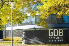 Front view of the GOB building with trees with autumnal yellow leaves