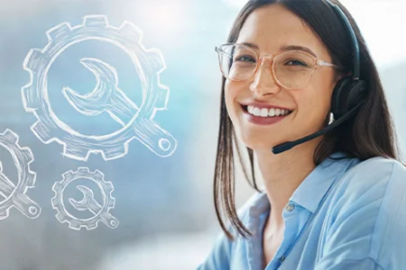Smiling woman carries out remote maintenance services Woman with headset smiling into camera; next to it cogwheels with maintenance symbols
