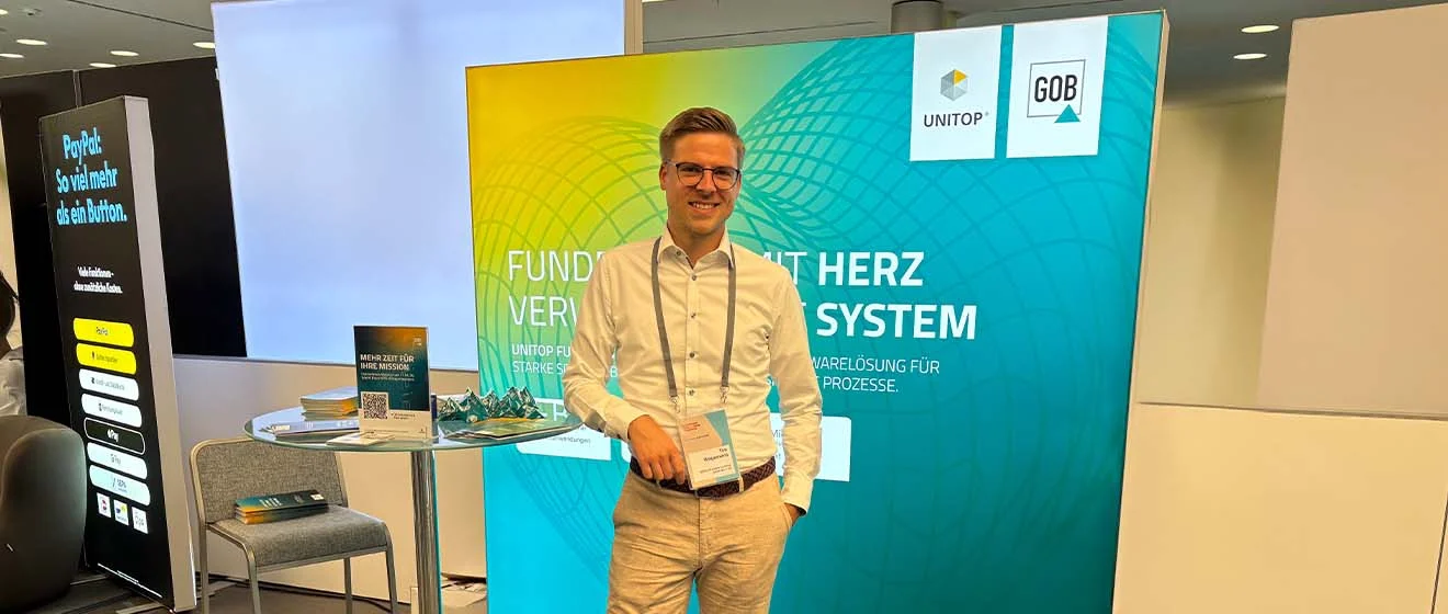 GOB-Stand auf dem DFK 2026 Tim Wagemans, Senior Vertriebsbeauftragter Fundraising bei der GOB, steht am GOB-Stand auf dem DFK 2026.